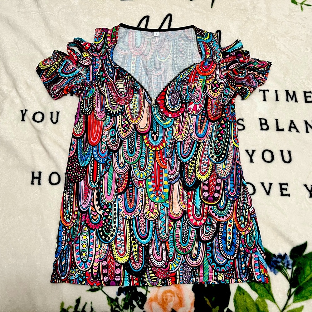 Cute, fun, and retro. Fits like a large.